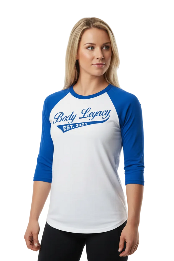 A 3/4 sleeve raglan t-shirt with a white body and royal blue sleeves, featuring 'Body Legacy EST. 2021' printed in blue across the chest.