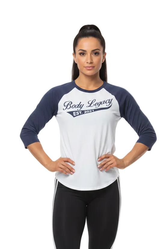 A 3/4 sleeve raglan t-shirt with a white body and navy blue sleeves, featuring 'Body Legacy EST. 2021' printed in navy on the chest.